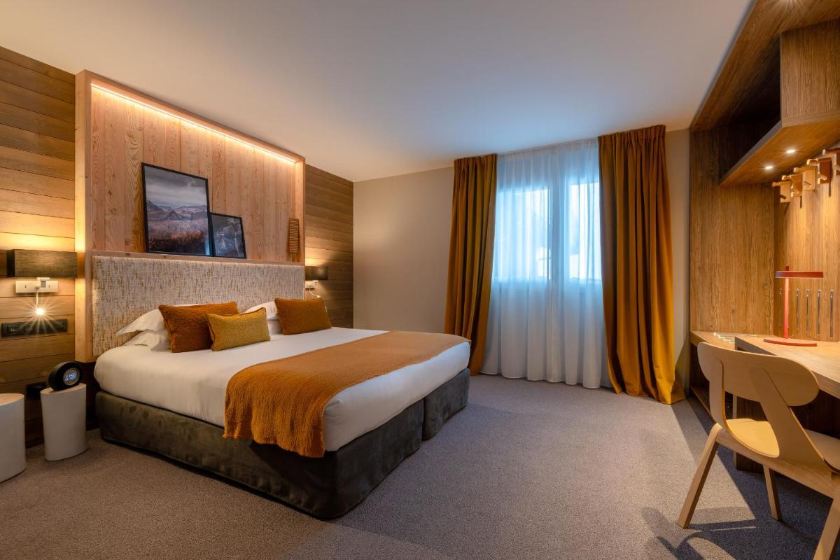 Un ou plusieurs lits dans un hébergement de l'établissement ILY Hotels & Spa La Rosiere