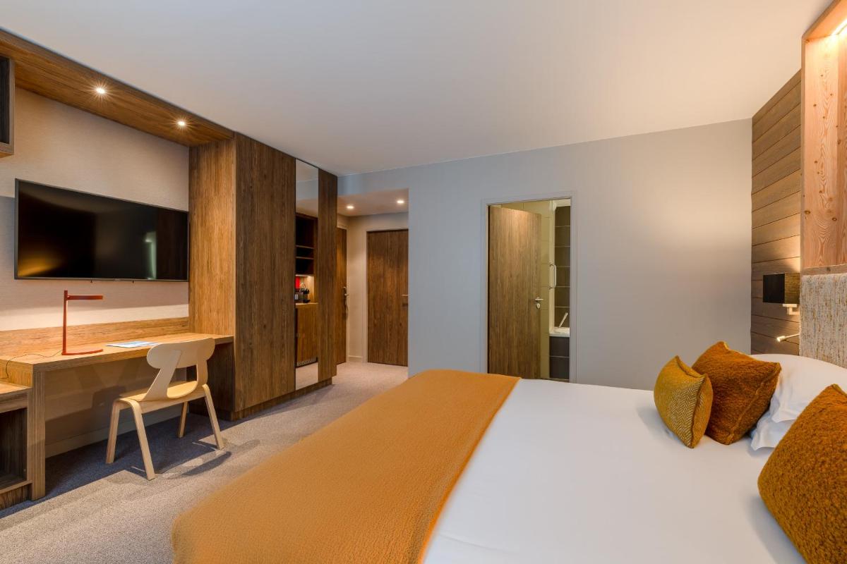 Un ou plusieurs lits dans un hébergement de l'établissement ILY Hotels & Spa La Rosiere