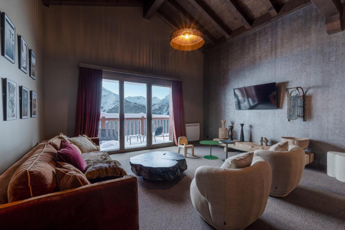 Coin salon dans l'établissement ILY Hotels & Spa La Rosiere