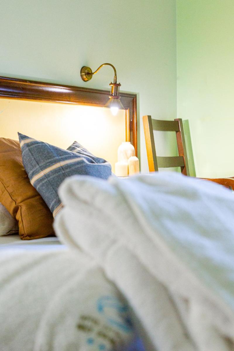 Cama o camas de una habitación en Hotel Balneario Río Pambre