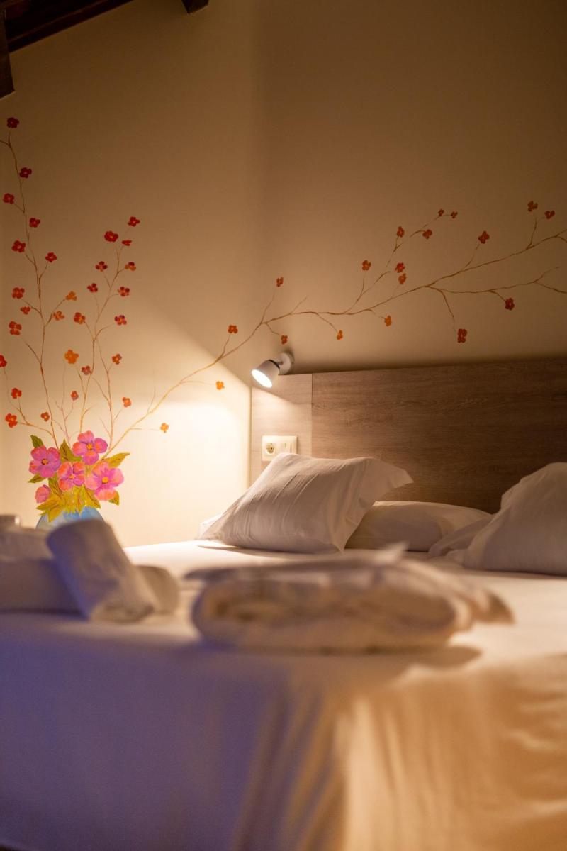 Cama o camas de una habitación en Hotel Balneario Río Pambre