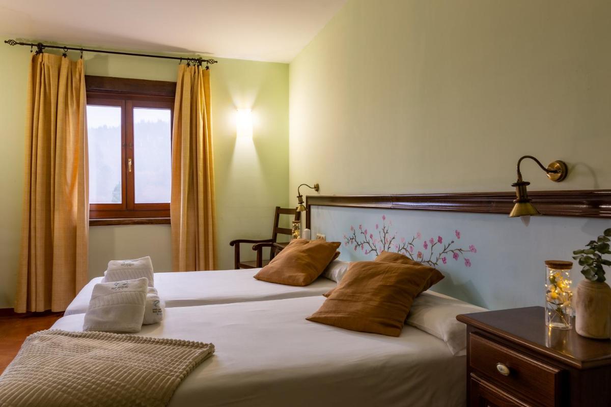 Cama o camas de una habitación en Hotel Balneario Río Pambre