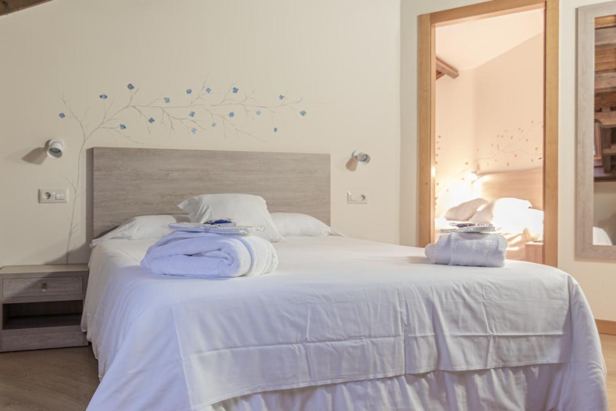 Cama o camas de una habitación en Hotel Balneario Río Pambre