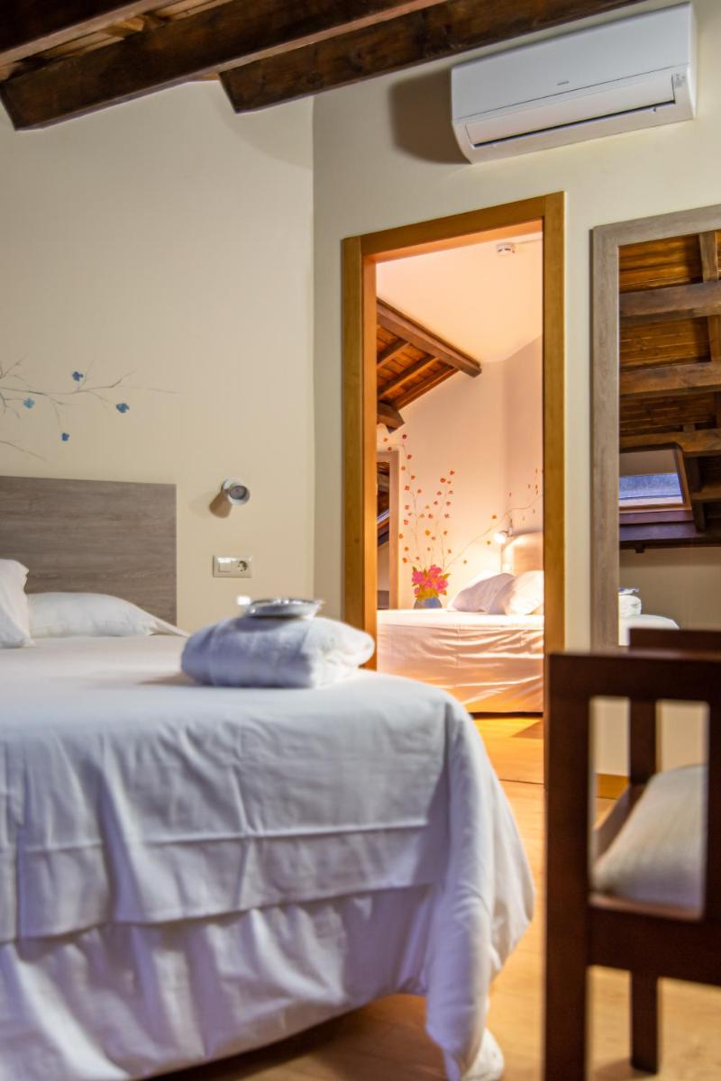 Cama o camas de una habitación en Hotel Balneario Río Pambre