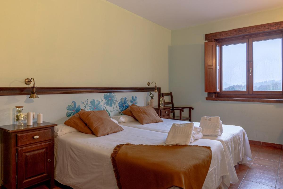 Cama o camas de una habitación en Hotel Balneario Río Pambre