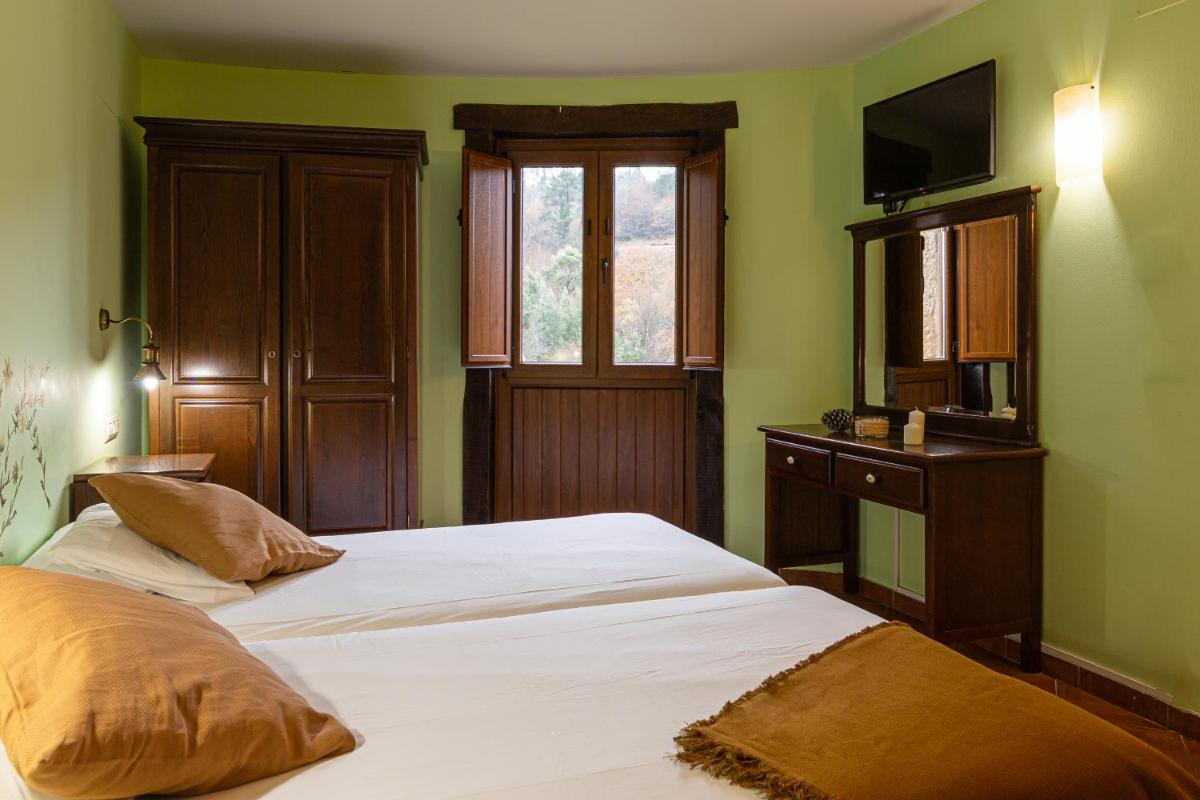 Cama o camas de una habitación en Hotel Balneario Río Pambre