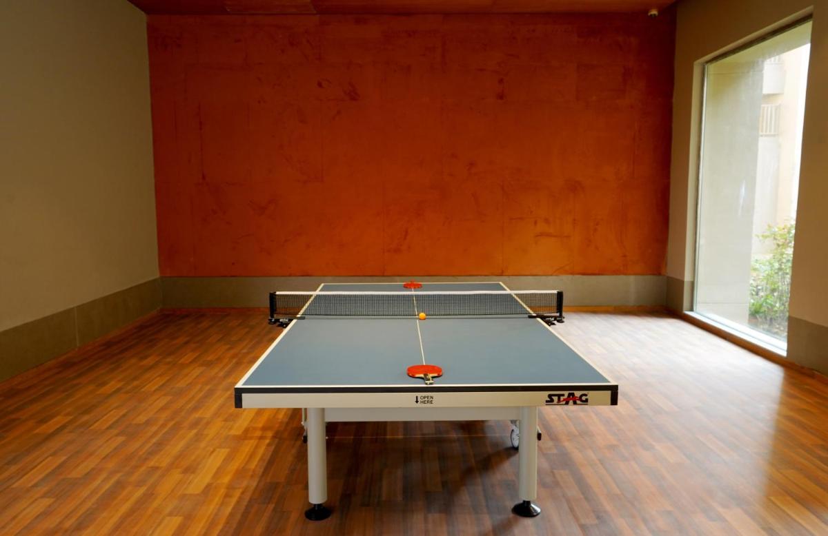 a ping pong table in the middle of a room at The Centrum in Lucknow