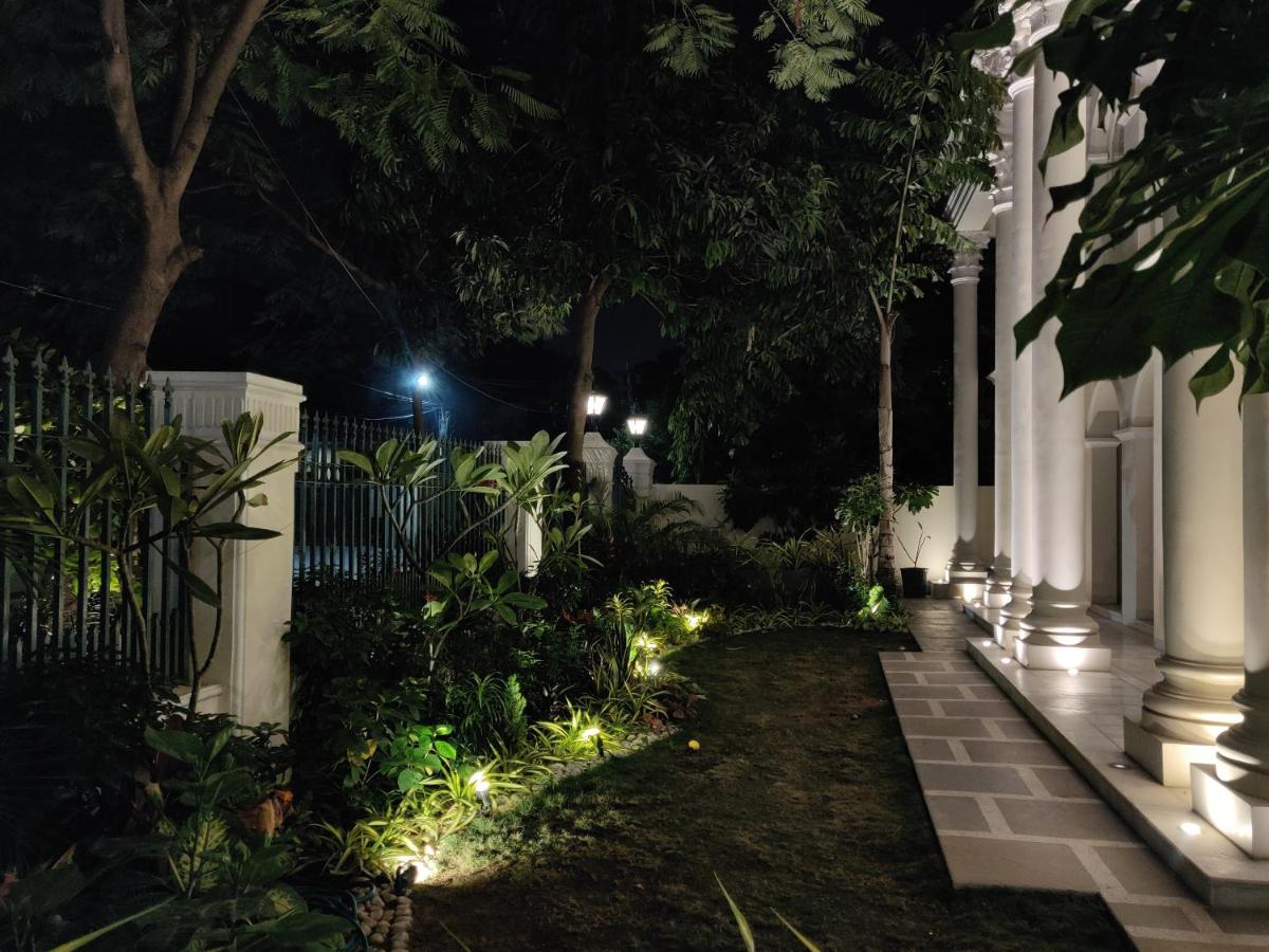 a garden with lights in the yard at night at Dileep Kothi - A Royal Boutique Luxury Suites in Jaipur in Jaipur