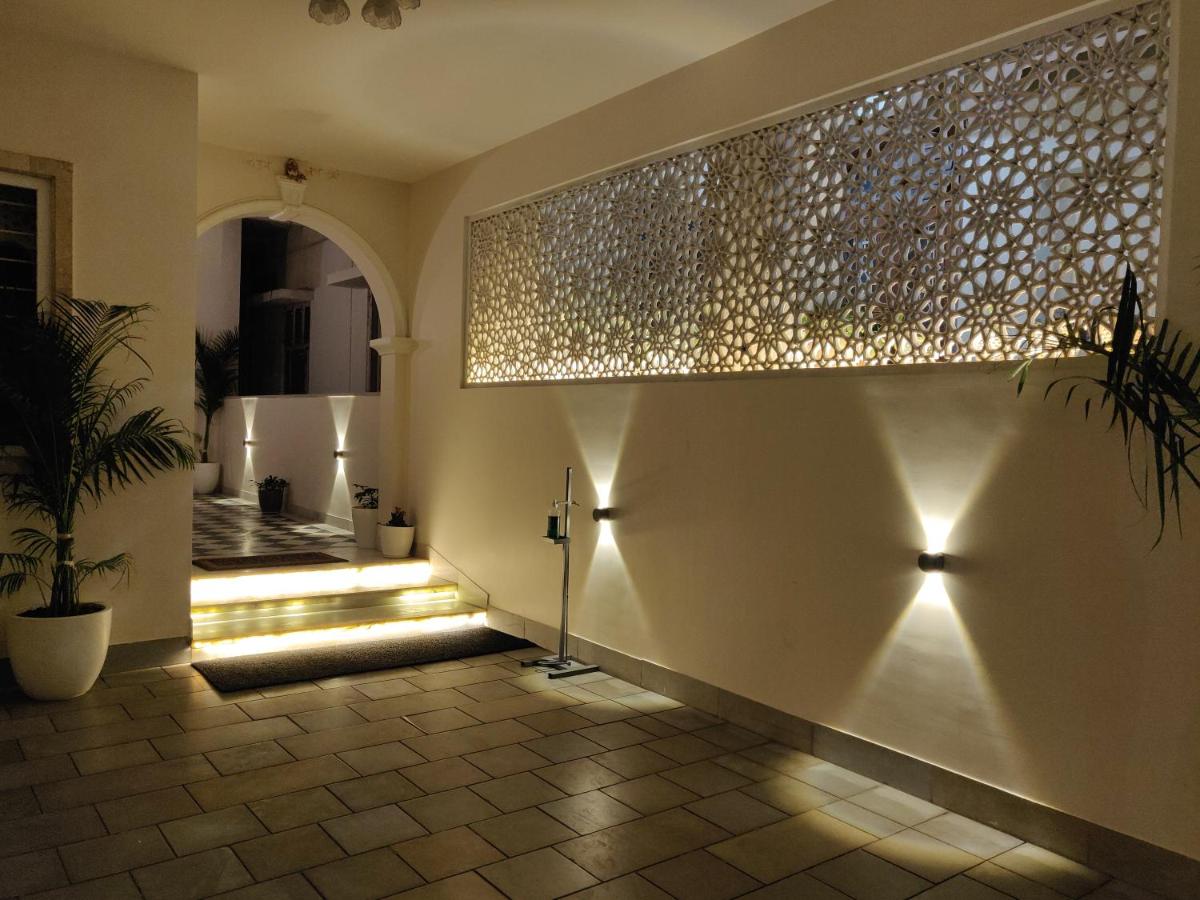 a hallway with a wall with lights on it at Dileep Kothi - A Royal Boutique Luxury Suites in Jaipur in Jaipur