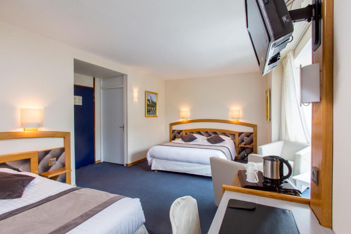 Un ou plusieurs lits dans un hébergement de l'établissement Best Western Le Relais de Laguiole Hôtel & Spa