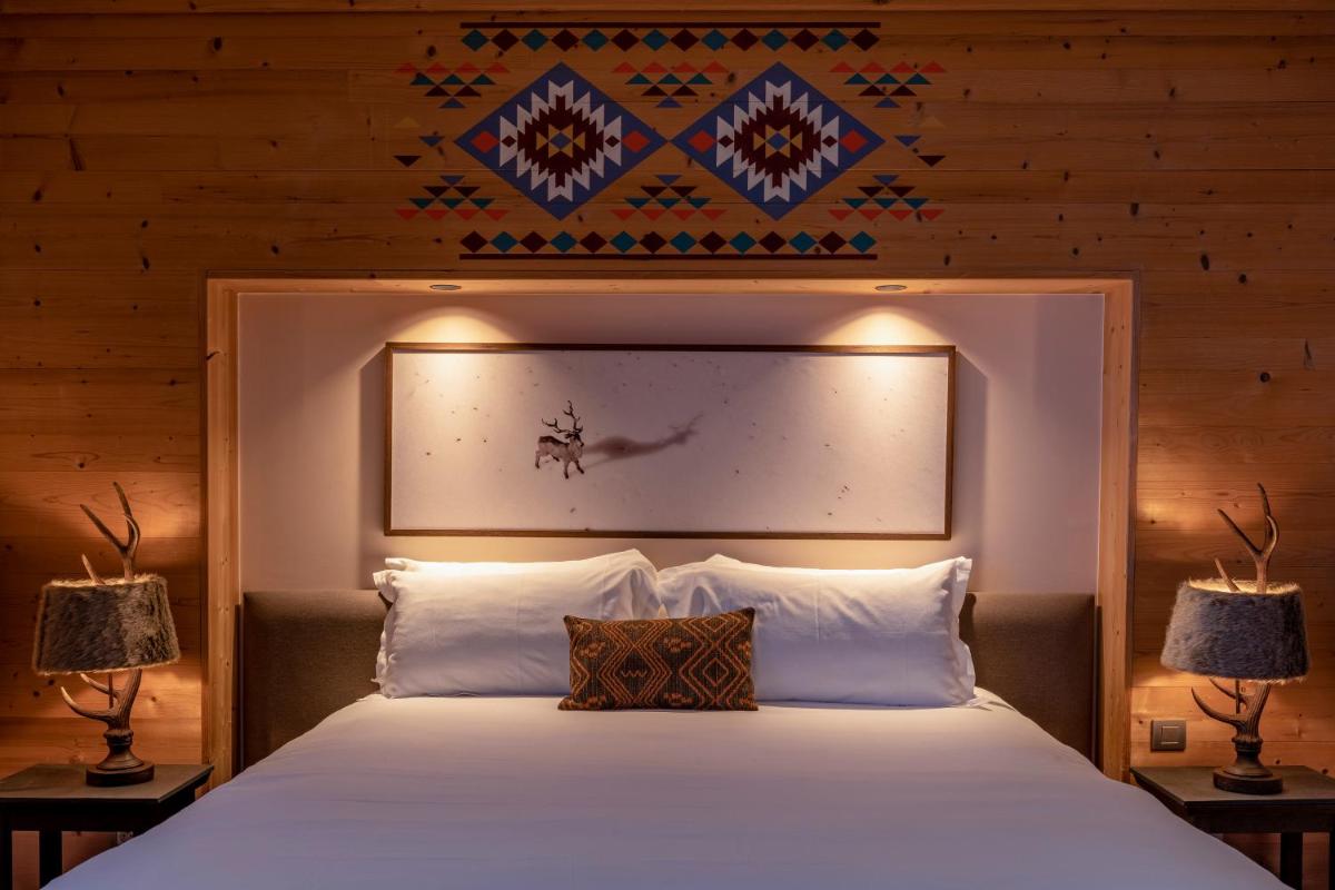 Un ou plusieurs lits dans un hébergement de l'établissement Chalet Hotel Kaya
