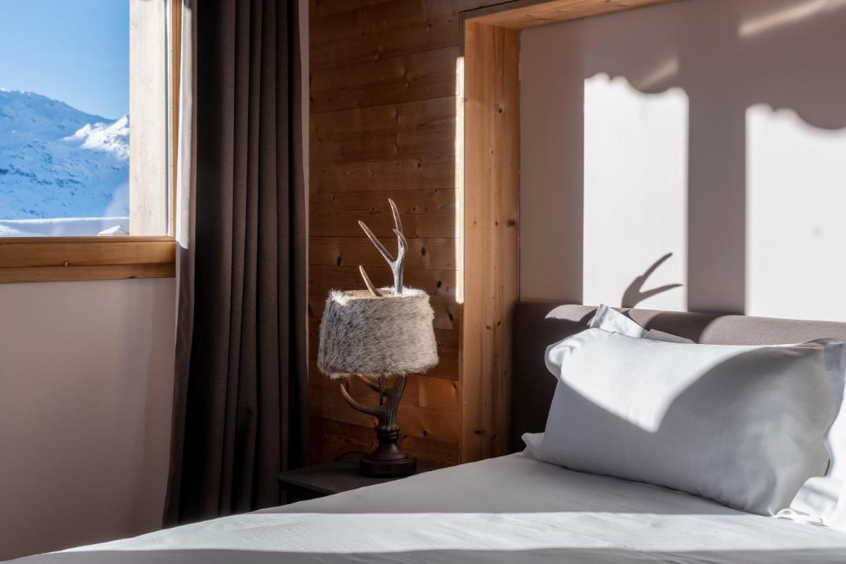 Un ou plusieurs lits dans un hébergement de l'établissement Chalet Hotel Kaya