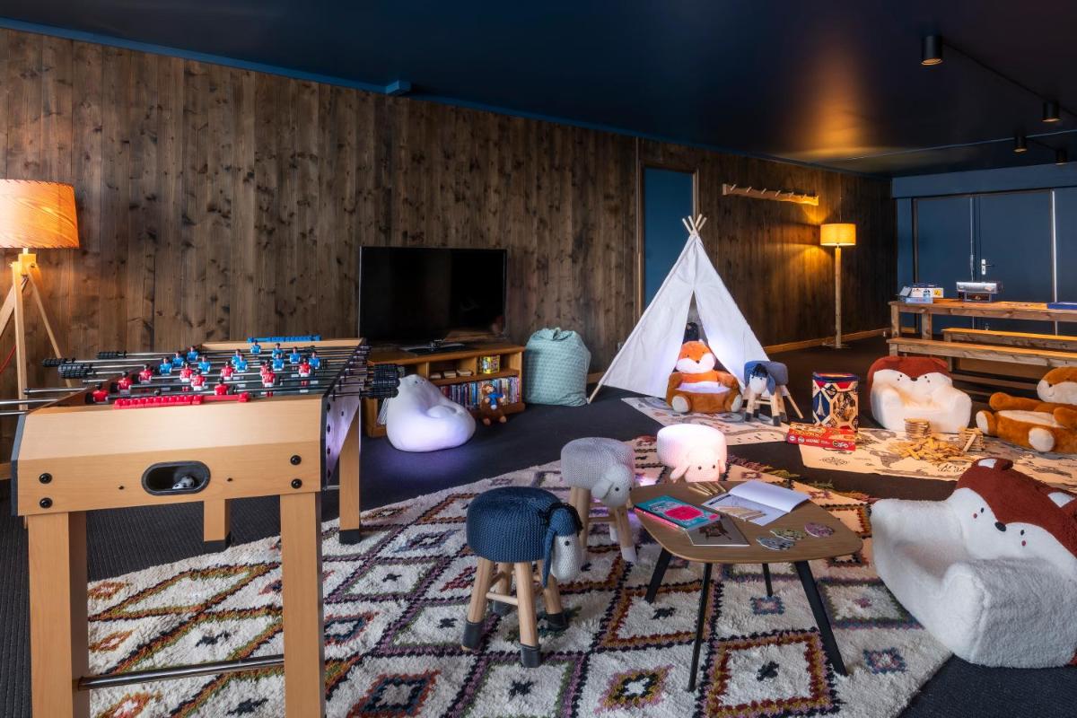 Télévision ou salle de divertissement dans l'établissement Chalet Hotel Kaya