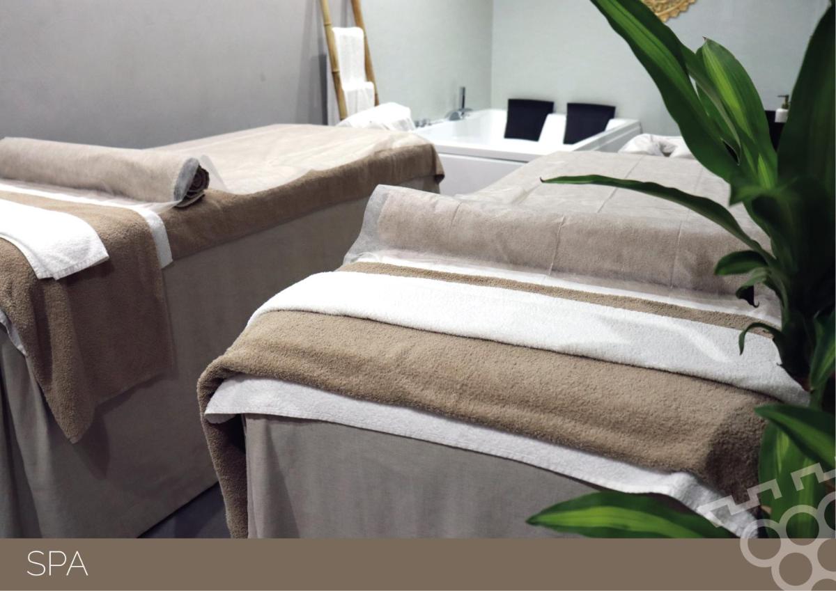 Uma cama ou camas num quarto em Douro Castelo Signature Hotel & Spa