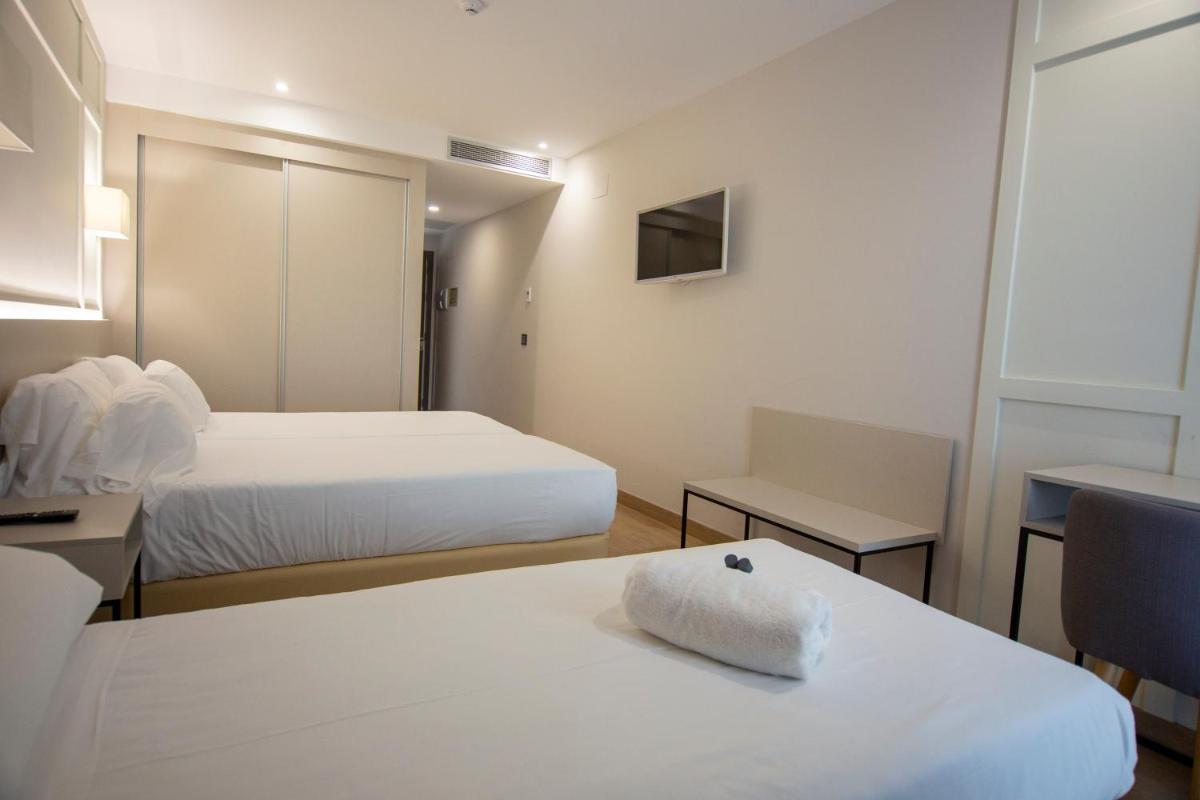 Cama o camas de una habitación en Oca Playa de Foz Hotel & Spa