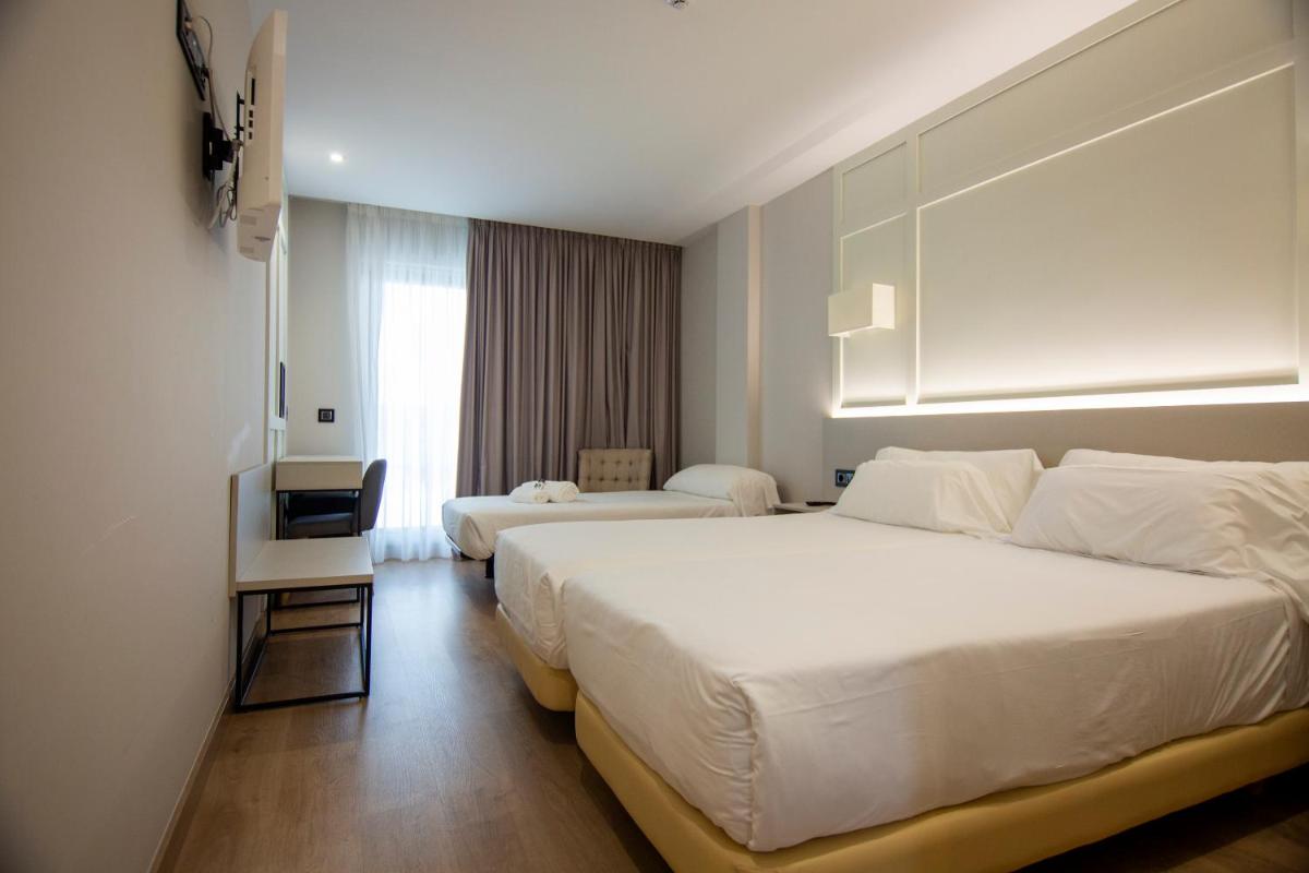 Cama o camas de una habitación en Oca Playa de Foz Hotel & Spa