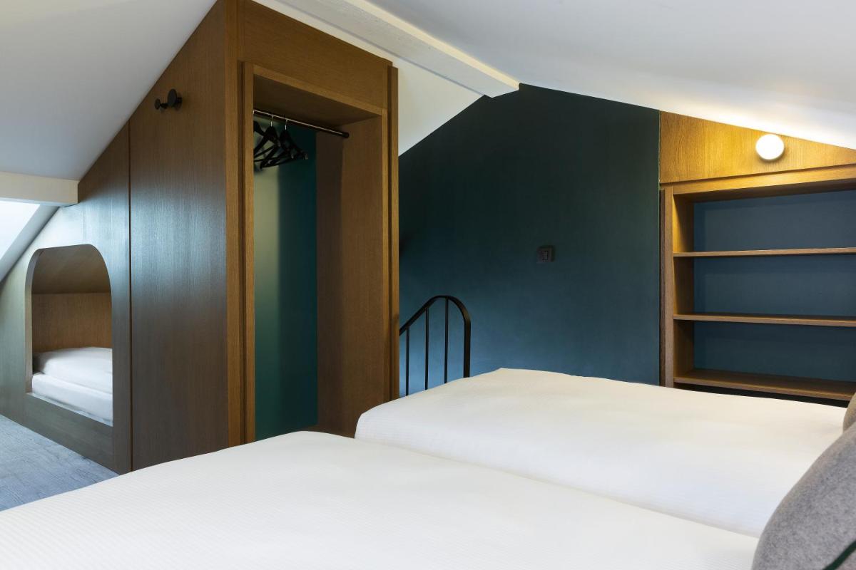Un ou plusieurs lits dans un hébergement de l'établissement Ours Blanc Hotel & Spa