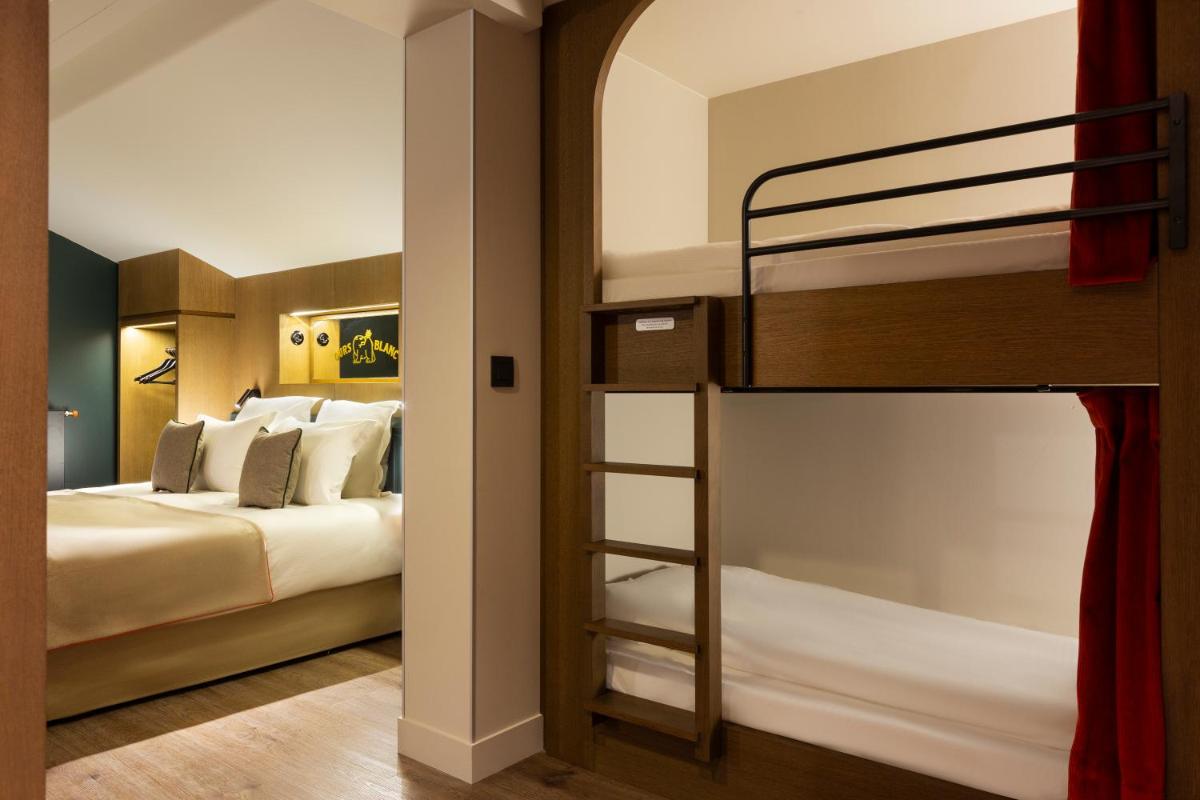Un ou plusieurs lits dans un hébergement de l'établissement Ours Blanc Hotel & Spa