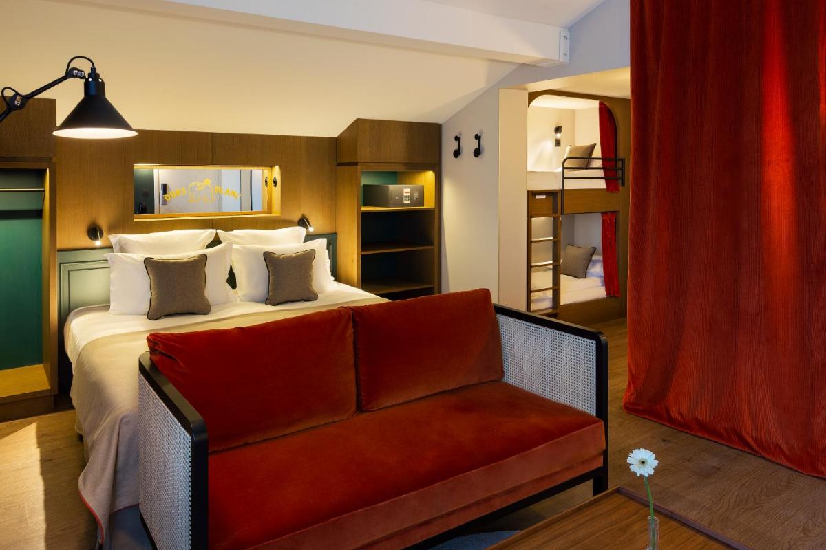 Un ou plusieurs lits dans un hébergement de l'établissement Ours Blanc Hotel & Spa