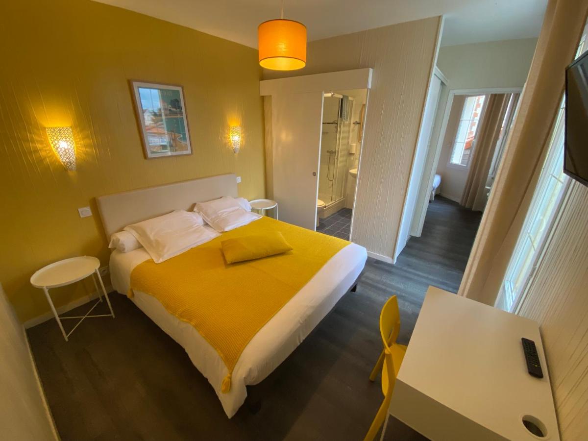 Un ou plusieurs lits dans un hébergement de l'établissement Hôtel de charme & SPA Le Grand Large