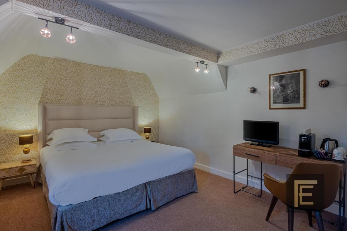 Un ou plusieurs lits dans un hébergement de l'établissement Auberge du Bon Laboureur Chenonceaux