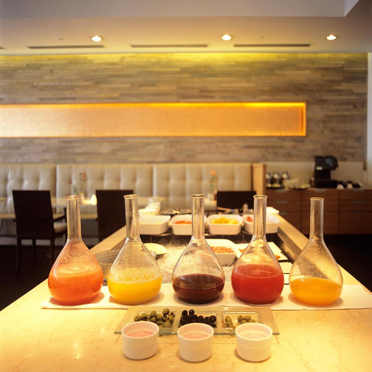 a group of four wine bottles sitting on a table at Trident Chennai in Chennai