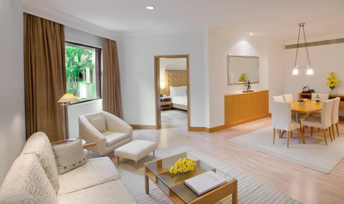 a living room with a couch and a table at Trident Chennai in Chennai