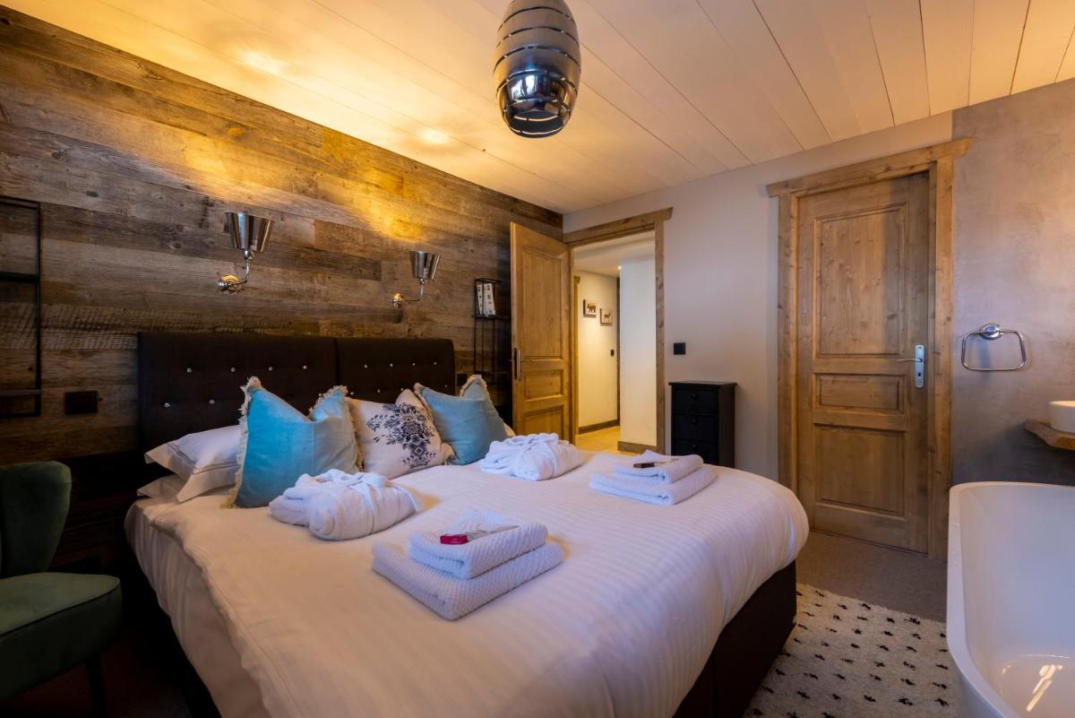 Un ou plusieurs lits dans un hébergement de l'établissement Hôtel et Chalet Au Coin Du Feu Chilly Powder