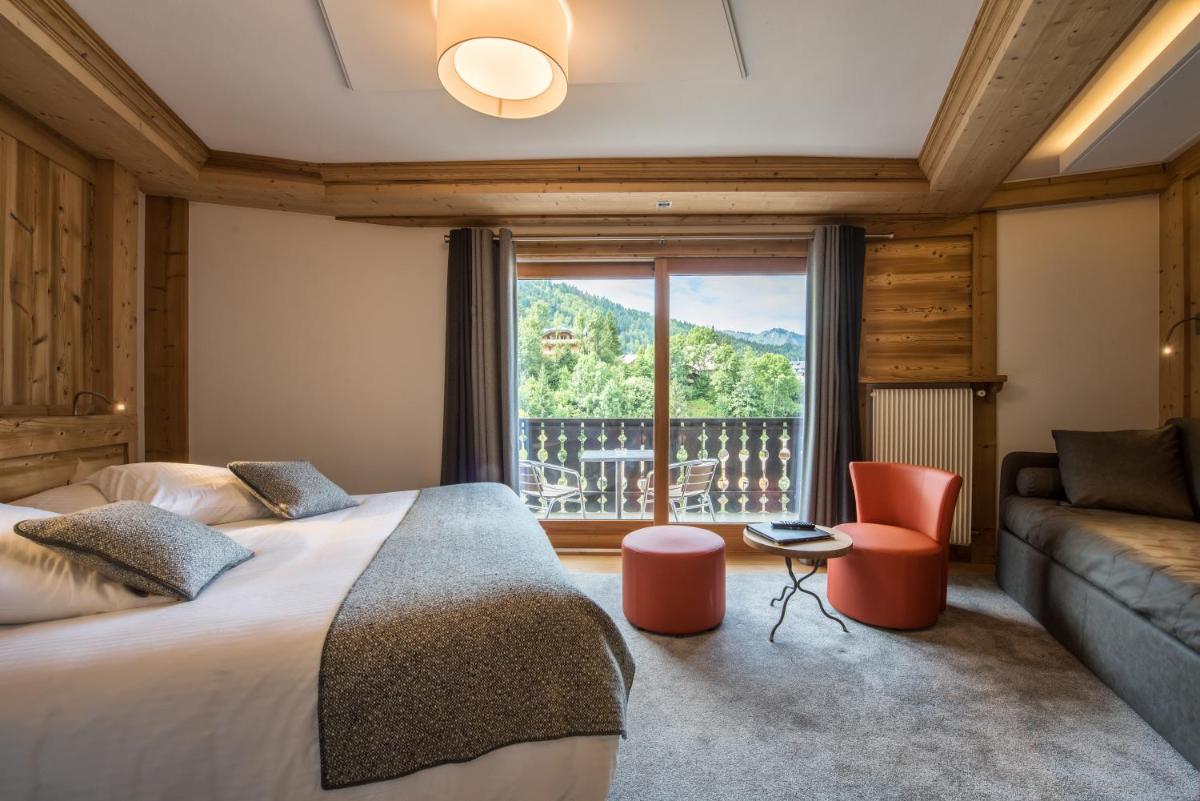Un ou plusieurs lits dans un hébergement de l'établissement Hotel le Petit Dru