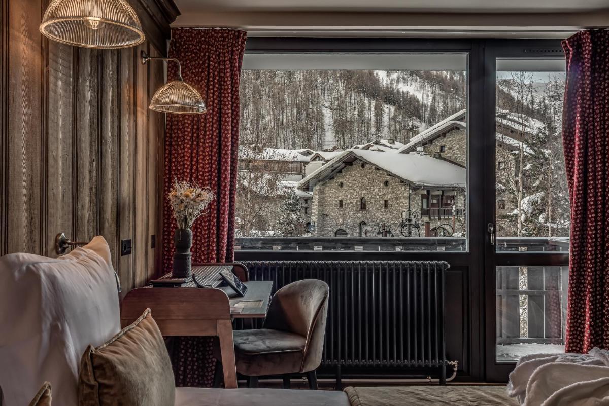 Un ou plusieurs lits dans un hébergement de l'établissement Hotel & Spa Le Val d'Isère