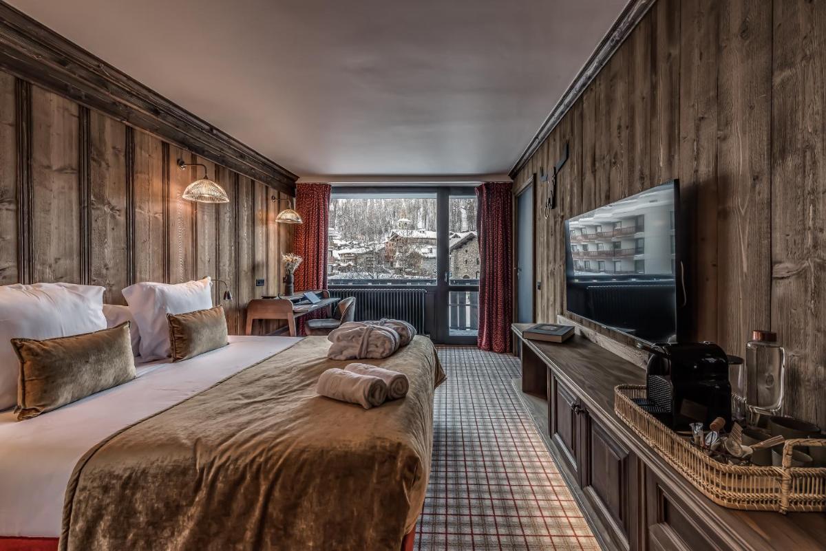 Télévision ou salle de divertissement dans l'établissement Hotel & Spa Le Val d'Isère