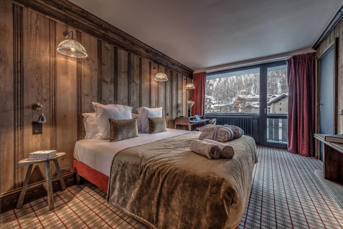 Un ou plusieurs lits dans un hébergement de l'établissement Hotel & Spa Le Val d'Isère