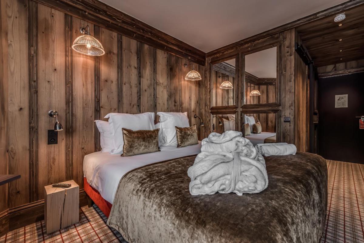 Un ou plusieurs lits dans un hébergement de l'établissement Hotel & Spa Le Val d'Isère
