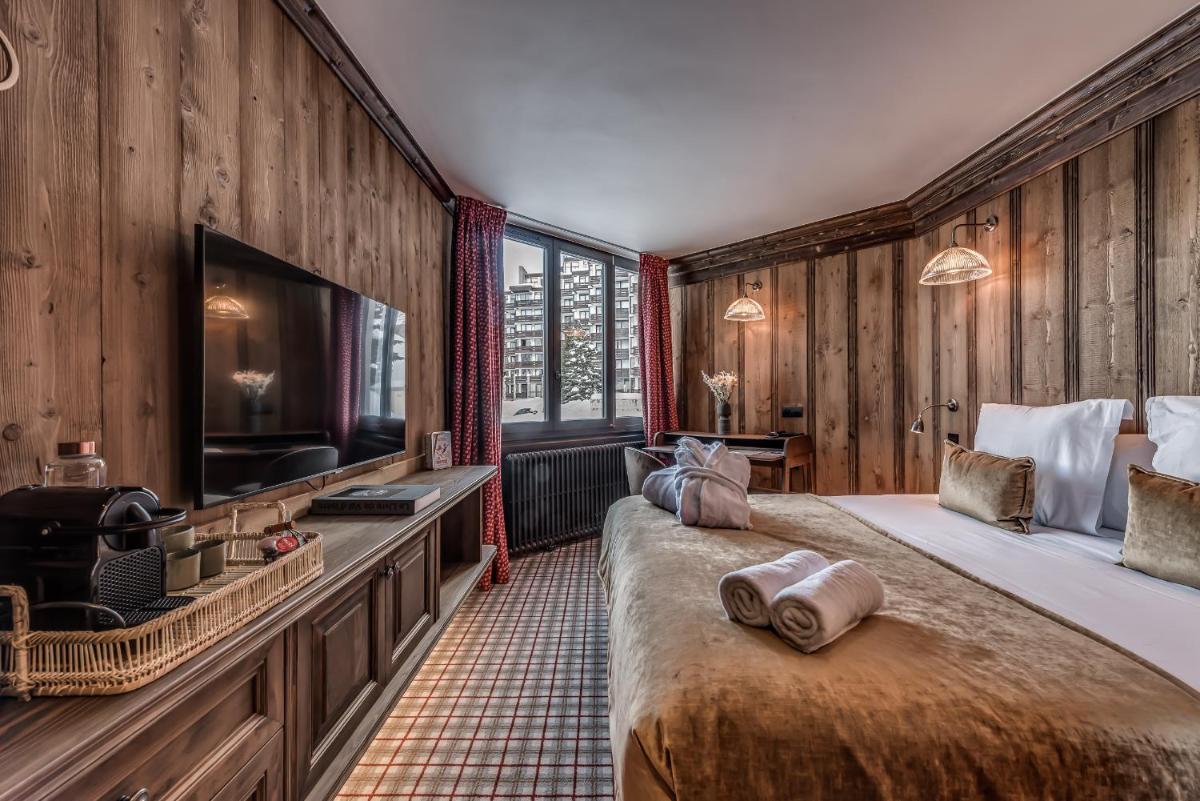 Un ou plusieurs lits dans un hébergement de l'établissement Hotel & Spa Le Val d'Isère