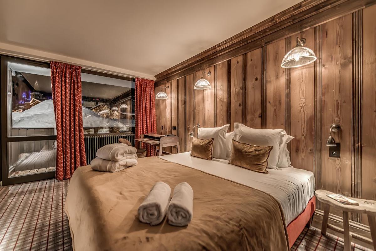Un ou plusieurs lits dans un hébergement de l'établissement Hotel & Spa Le Val d'Isère