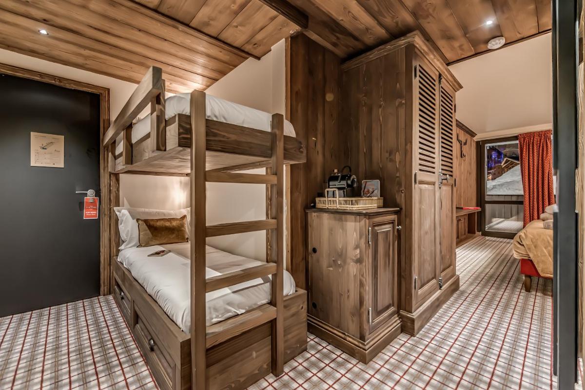 Un ou plusieurs lits dans un hébergement de l'établissement Hotel & Spa Le Val d'Isère