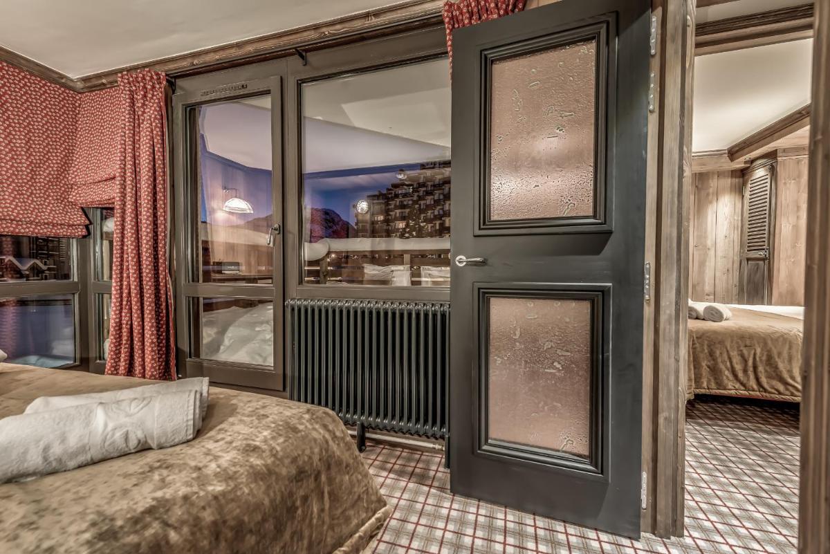 Un ou plusieurs lits dans un hébergement de l'établissement Hotel & Spa Le Val d'Isère