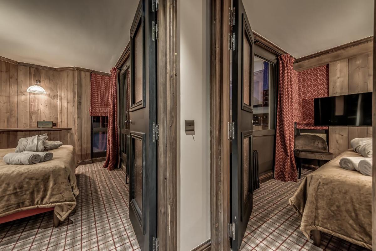 Un ou plusieurs lits dans un hébergement de l'établissement Hotel & Spa Le Val d'Isère