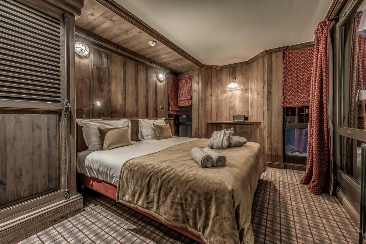 Un ou plusieurs lits dans un hébergement de l'établissement Hotel & Spa Le Val d'Isère