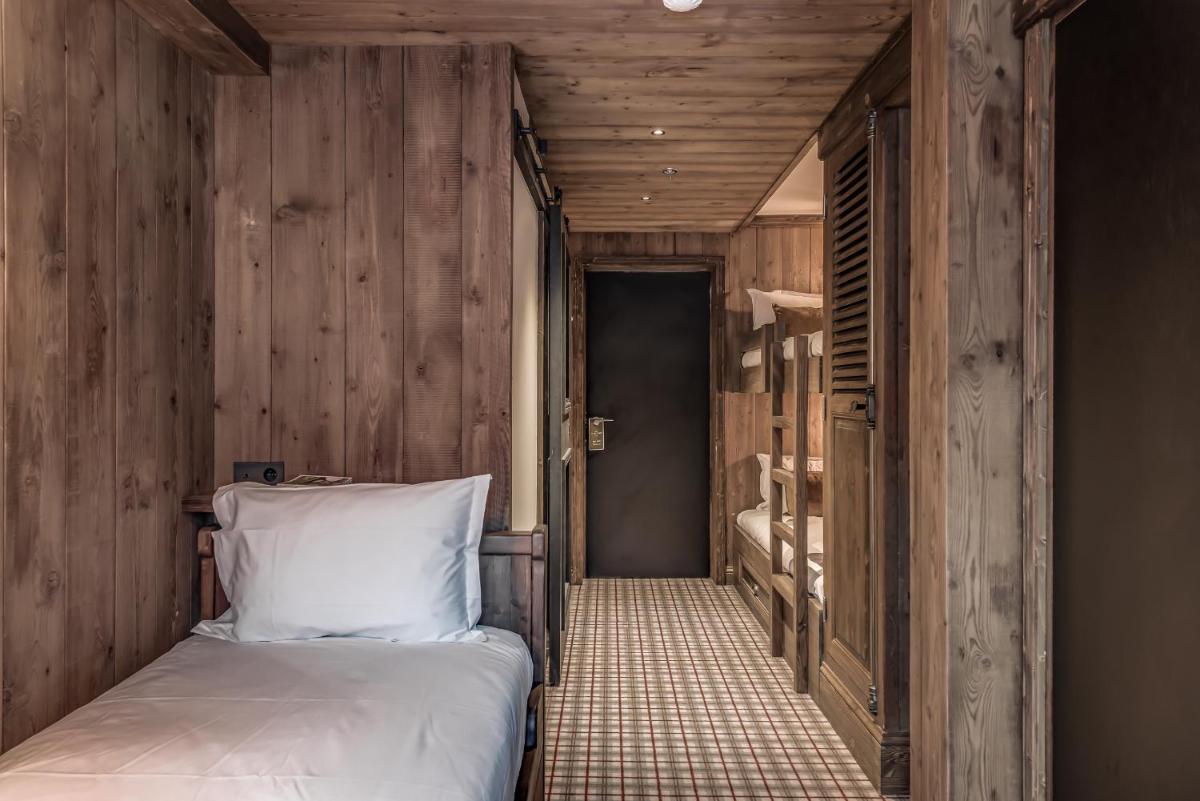 Un ou plusieurs lits dans un hébergement de l'établissement Hotel & Spa Le Val d'Isère