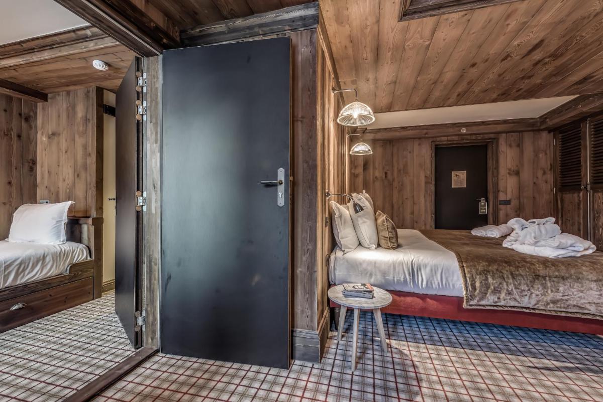 Un ou plusieurs lits dans un hébergement de l'établissement Hotel & Spa Le Val d'Isère