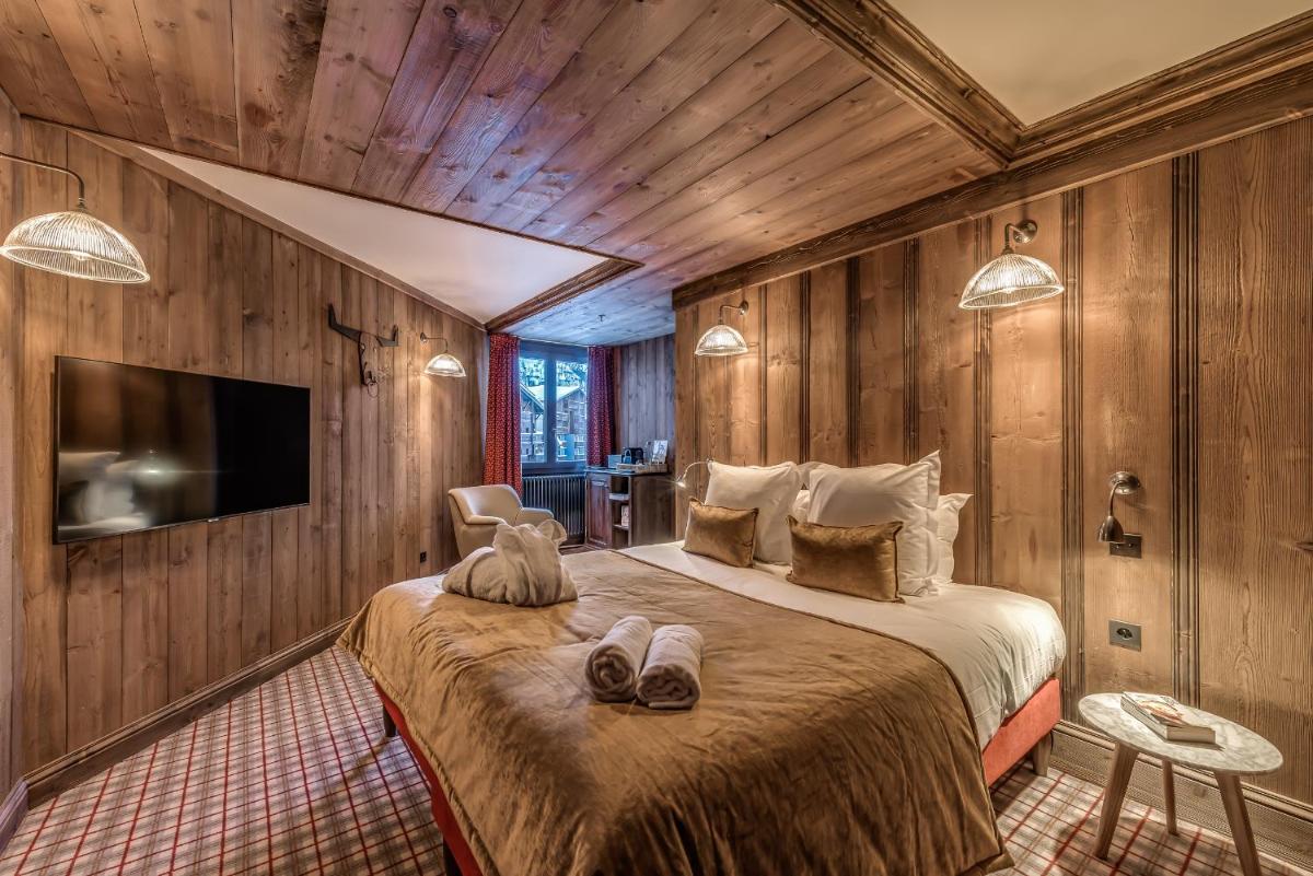 Un ou plusieurs lits dans un hébergement de l'établissement Hotel & Spa Le Val d'Isère