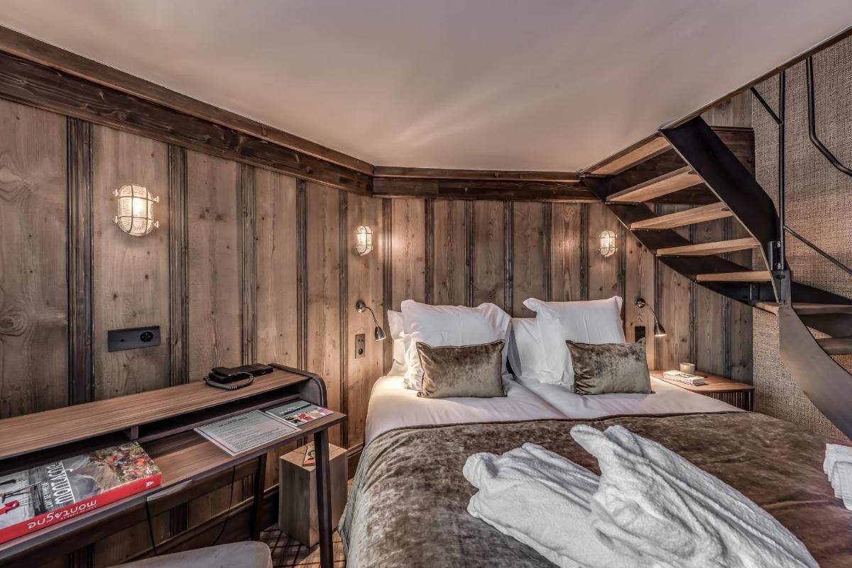 Un ou plusieurs lits dans un hébergement de l'établissement Hotel & Spa Le Val d'Isère
