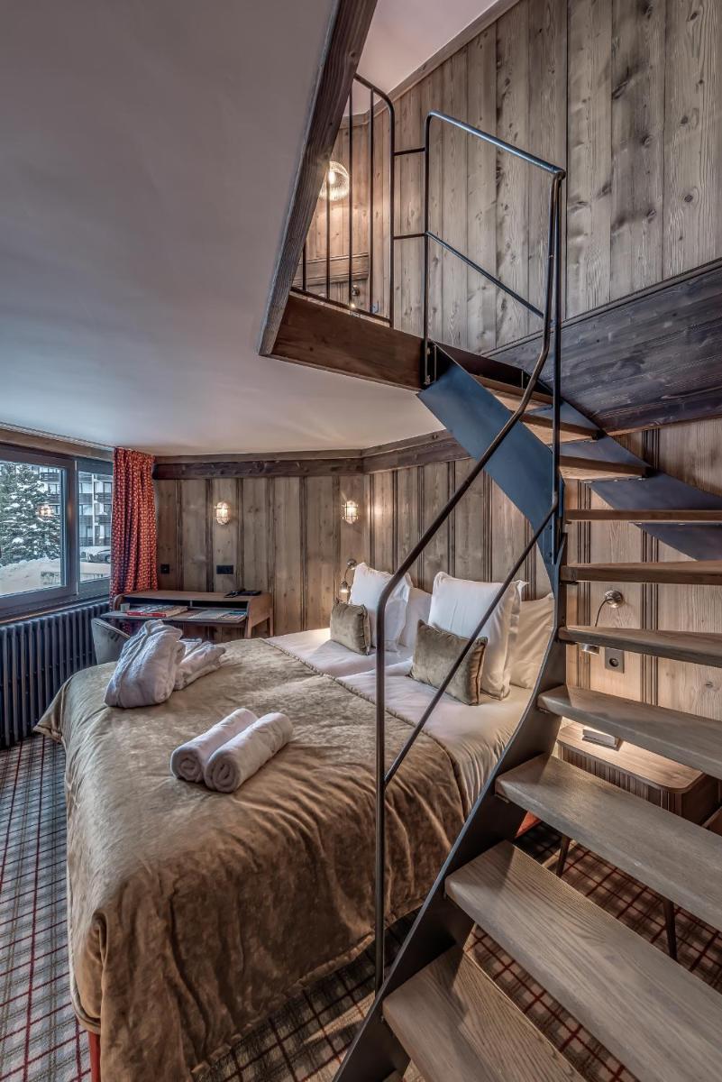 Un ou plusieurs lits dans un hébergement de l'établissement Hotel & Spa Le Val d'Isère