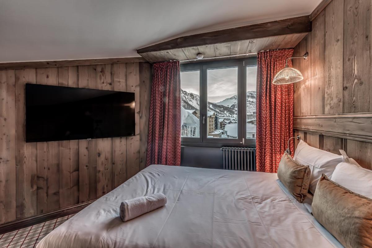 Un ou plusieurs lits dans un hébergement de l'établissement Hotel & Spa Le Val d'Isère
