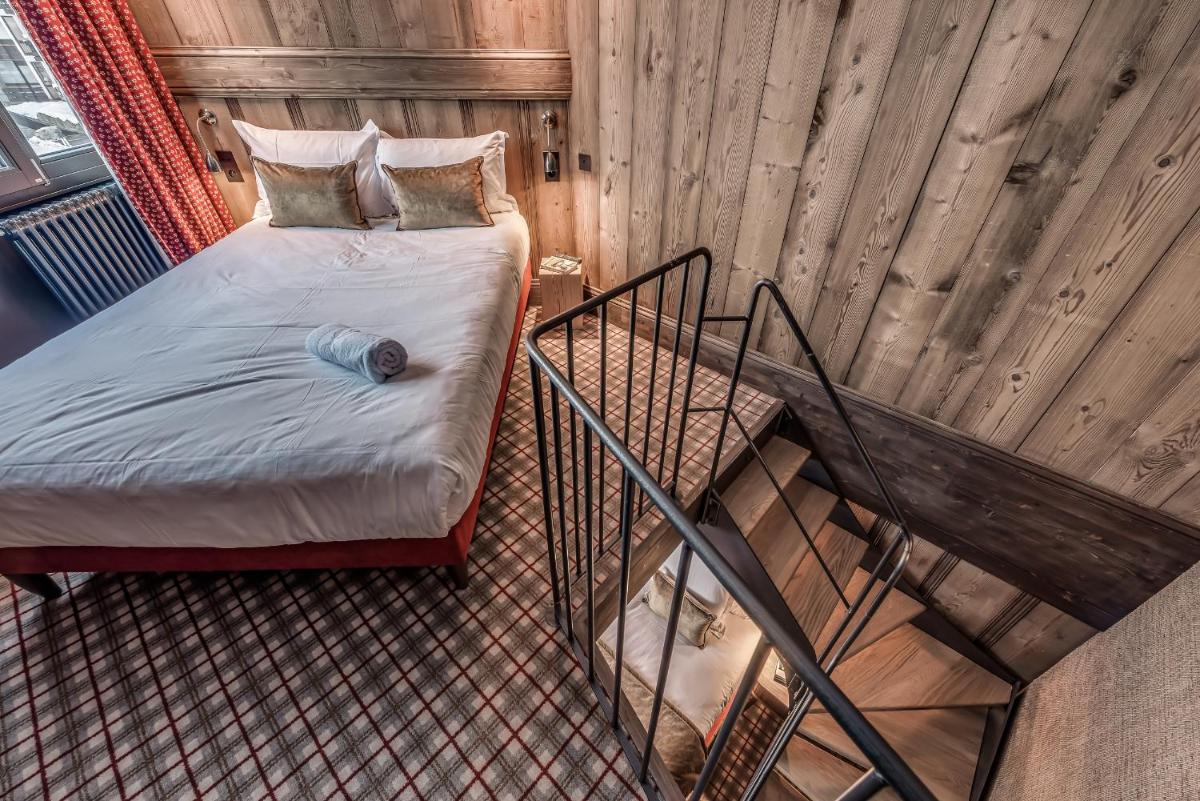 Un ou plusieurs lits dans un hébergement de l'établissement Hotel & Spa Le Val d'Isère
