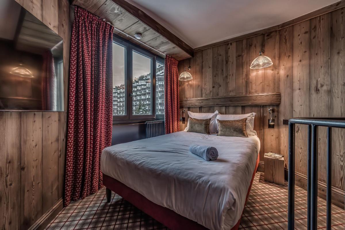 Un ou plusieurs lits dans un hébergement de l'établissement Hotel & Spa Le Val d'Isère