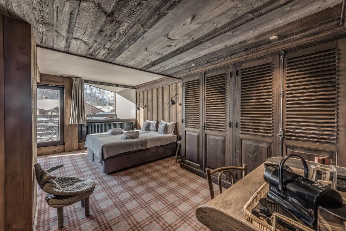 Un ou plusieurs lits dans un hébergement de l'établissement Hotel & Spa Le Val d'Isère
