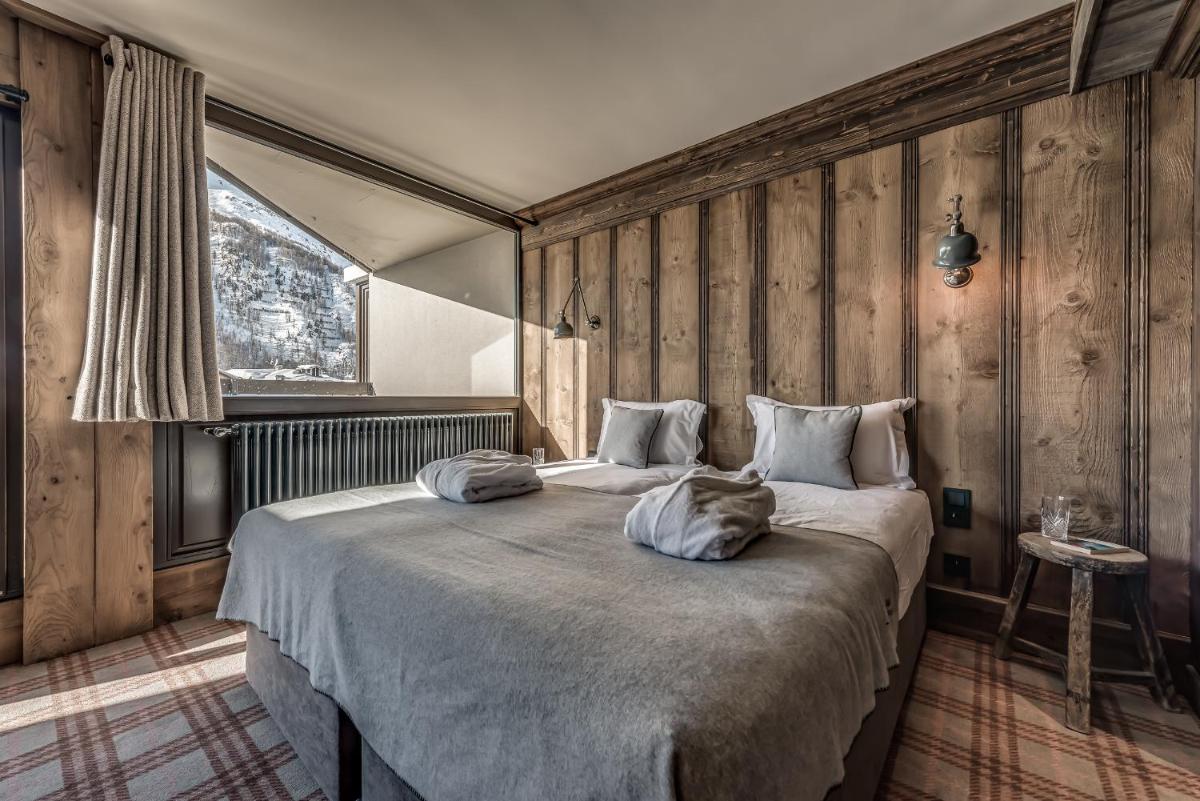 Un ou plusieurs lits dans un hébergement de l'établissement Hotel & Spa Le Val d'Isère