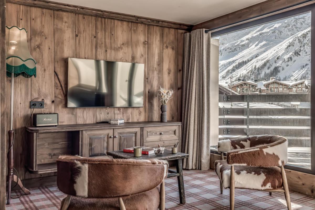 Télévision ou salle de divertissement dans l'établissement Hotel & Spa Le Val d'Isère